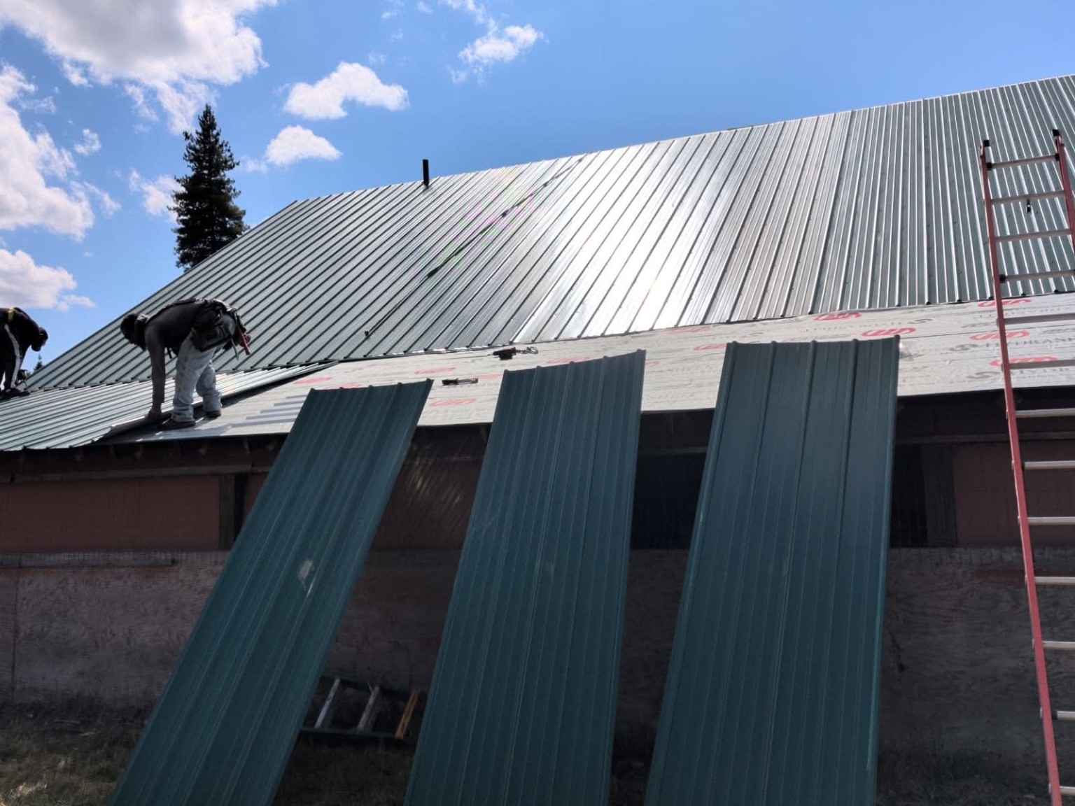 Metal roof installation in progress